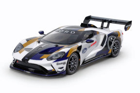 Tamiya TT-02 2020 Ford GT MK II model car kit with detailed plastic parts and assembly components.