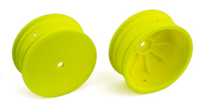 Team Associated 1/10 scale 4WD RC car buggy front 2.2-inch yellow wheels with 12mm hex for off-road racing.